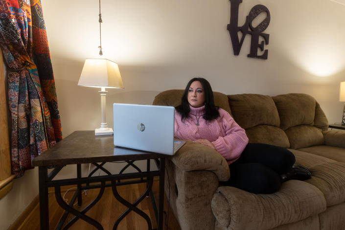 Nina McCollum, who relies on electronic communication to help care for her 80-year-old mother, in Parma, Ohio, Jan. 6, 2023. (Daniel Lozada/The New York Times)