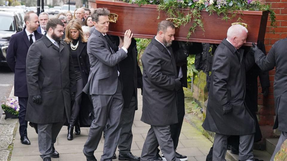 Kate Garraway follows the coffin into the funeral service of her husband Derek Draper