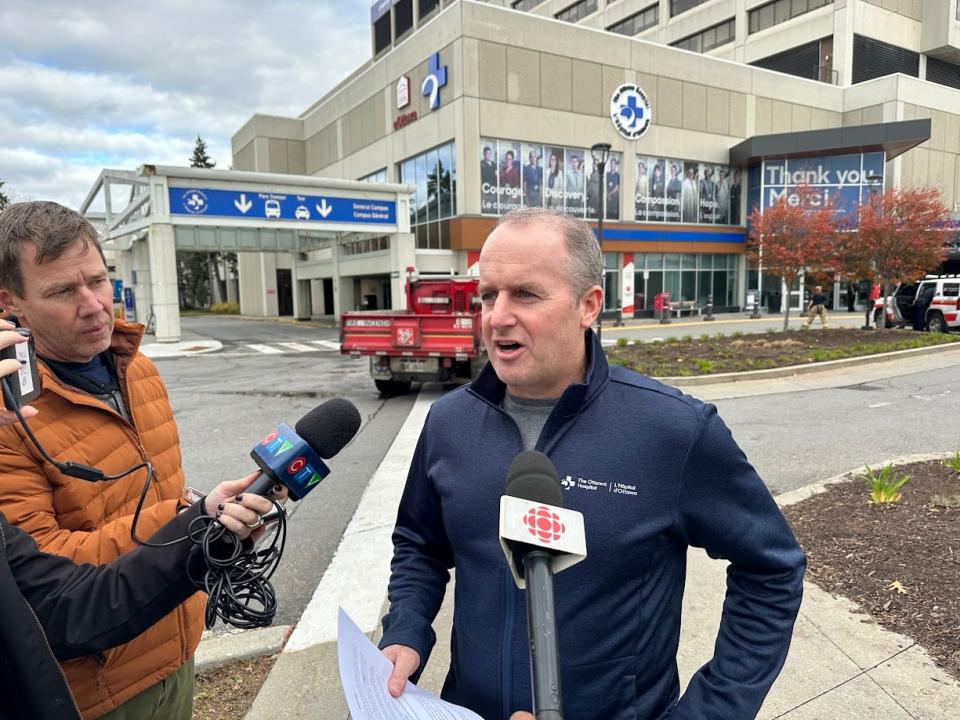 Cameron Love, president and CEO of the Ottawa Hospital, speaks to reporters on Oct. 28, 2023 after a fire at the hospital's general campus the day before. 