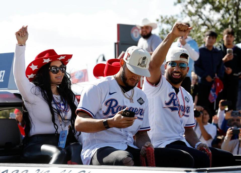 Texas Rangers short stop Ezequiel Duran and pitcher Jonathan Hernandez pass by during the Texas Rangers World Series Parade in Arlington, Texas, Friday, Nov. 03, 2023. (Special to the Star-Telegram Bob Booth)