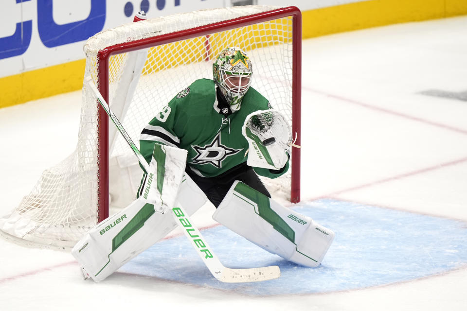 Dallas Stars goaltender Jake Oettinger gloves a shot from the Colorado Avalanche in overtime of Game 2 of an NHL hockey Stanley Cup second-round playoff series in Dallas, Tuesday, May 7, 2024. (AP Photo/LM Otero)