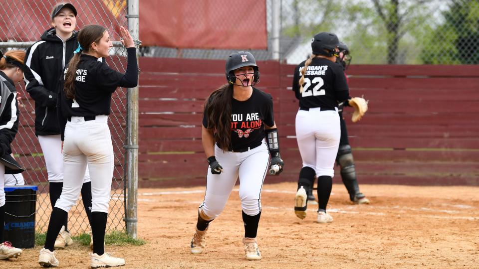 Kingsway's Hannah Weismer, center, celebrates after scoring the game winning run during the softball game between Kingsway and Haddon Heights played at Haddon Heights High School on Thursday, April 18, 2024.