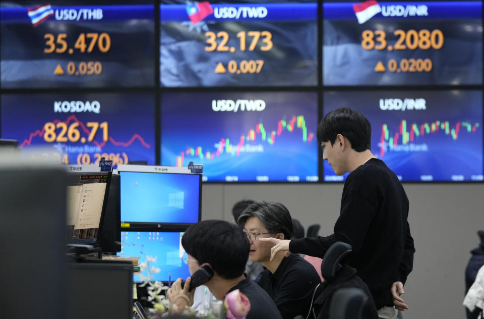 Currency traders work at the foreign exchange dealing room of the KEB Hana Bank headquarters in Seoul, South Korea, Wednesday, Nov. 8, 2023. Asian shares were mixed in muted trading on Wednesday as attention focused on prospects for improved China-U.S. relations from meetings next week on the sidelines of a Pacific Rim summit. (AP Photo/Ahn Young-joon)