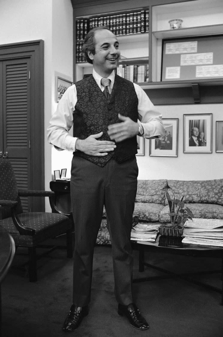 Ron Nessen, President Ford’s press secretary shows off a bulletproof vest that he wore at the morning press briefing, Thursday, May 1, 1975, at the White House in Washington. Nessen wore the protective clothing as a gag. (AP Photo/Charles Bennett)