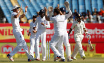 Cricket - India v England - First Test cricket match - Saurashtra Cricket Association Stadium, Rajkot, India - 12/11/16. England's players celebrate the dismissal of India's Ajinkya Rahane (R) wicket. REUTERS/Amit Dave
