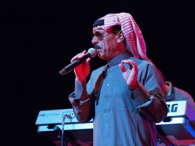 Celebrated Syrian singer Omar Souleyman performs in the early hours of March 16, 2013 at a benefit concert for victims and refugees of the conflict in his homeland during the South by Southwest (SXSW) festival in Austin, Texas