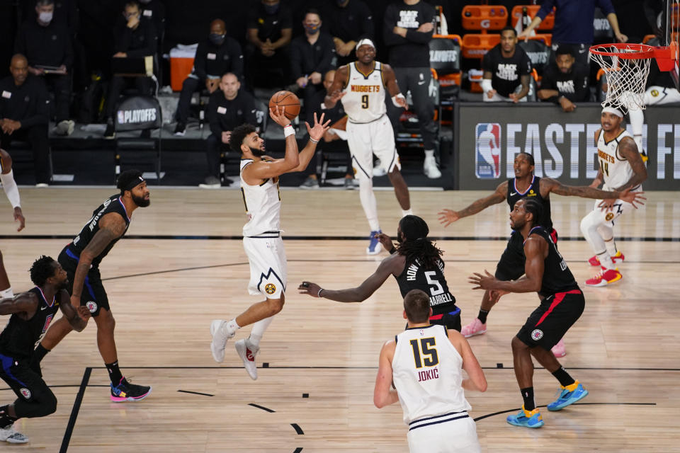 Denver Nuggets guard Jamal Murray (27) shoots against the Los Angeles Clippers during the second half of an NBA conference semifinal playoff basketball game Tuesday, Sept. 15, 2020, in Lake Buena Vista, Fla. (AP Photo/Mark J. Terrill)