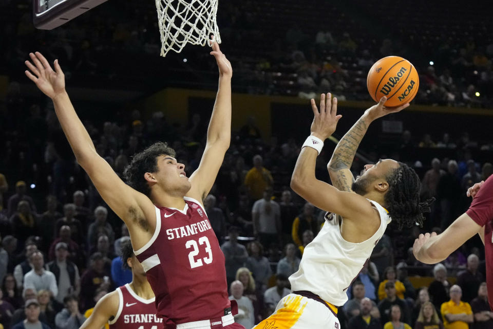 Arizona State guard Frankie Collins, right, shoots over Stanford forward Brandon Angel (23) during the second half of an NCAA college basketball game Thursday, Feb. 1, 2024, in Tempe, Ariz. Stanford won 71-62. (AP Photo/Ross D. Franklin)