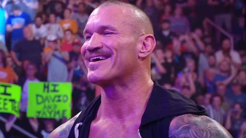  Randy Orton smiling at Cody Rhodes' Return to the WWE. 