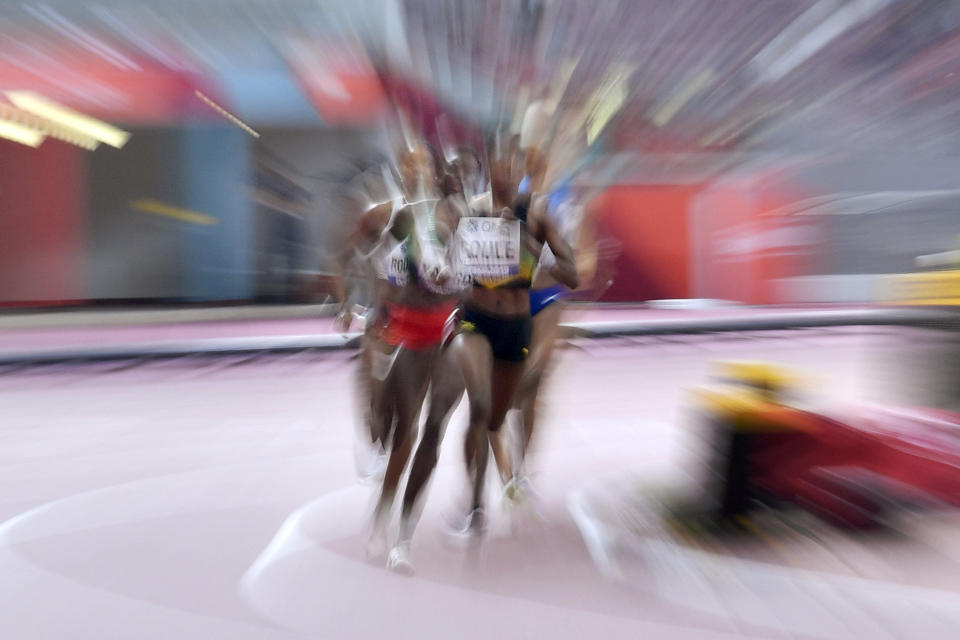 Natoya Goule, of Jamaica leads as she competes to win during the women's 800 meters heats during the World Athletics Championships Friday, Sept. 27, 2019, in Doha, Qatar. (AP Photo/Martin Meissner)