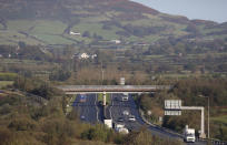 Motorists on the M1 motorway crossing the Irish border near the town of Jonesborough, Republic of Ireland, looking across the border into Northern Ireland, Wednesday, Oct. 16, 2019. (AP Photo/Peter Morrison)