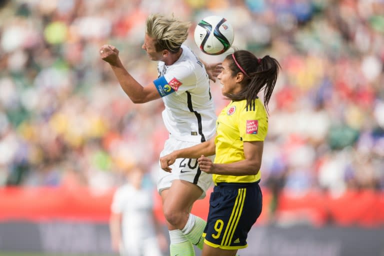 USA's Abby Wambach (L) and Colombia's Orianica Velasquez jump for the ball during their FIFA Women's World Cup Group of 16 Match in Edmonton, Canada on June 22, 2015