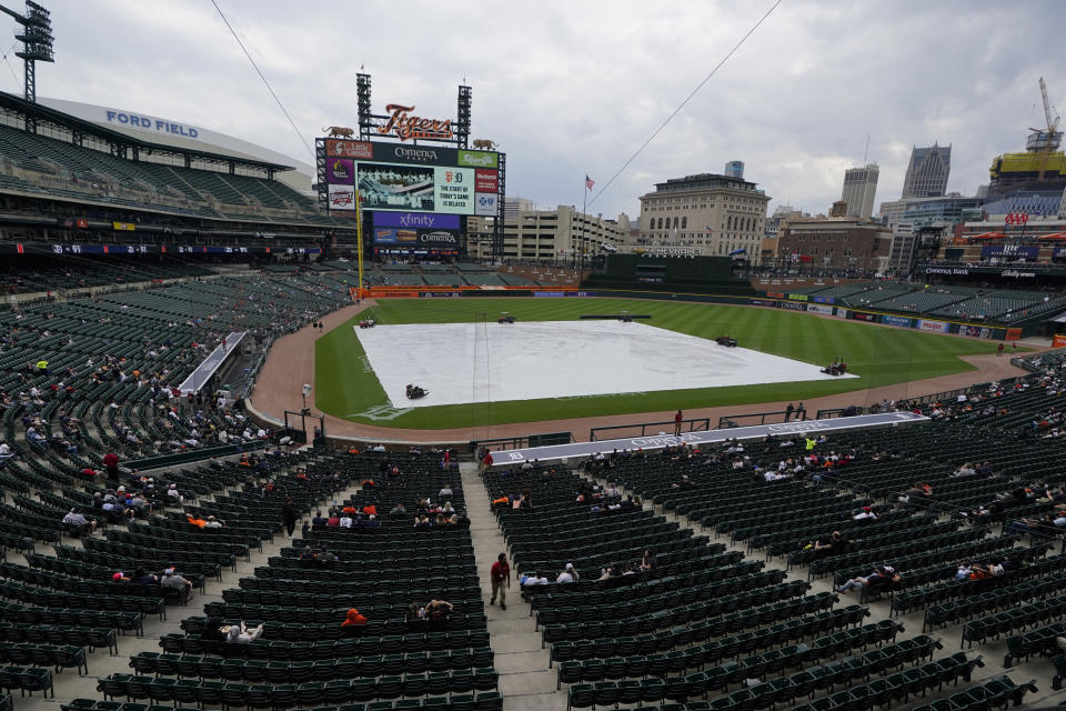 Baseball fans wait for the start of the baseball game between the Detroit Tigers and the San Francisco Giants, Sunday, April 16, 2023, in Detroit. (AP Photo/Carlos Osorio)