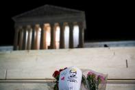 A bouquet of flowers is left in front of the U.S. Supreme Court following the death of U.S. Supreme Court Justice Ruth Bader Ginsburg, in Washington