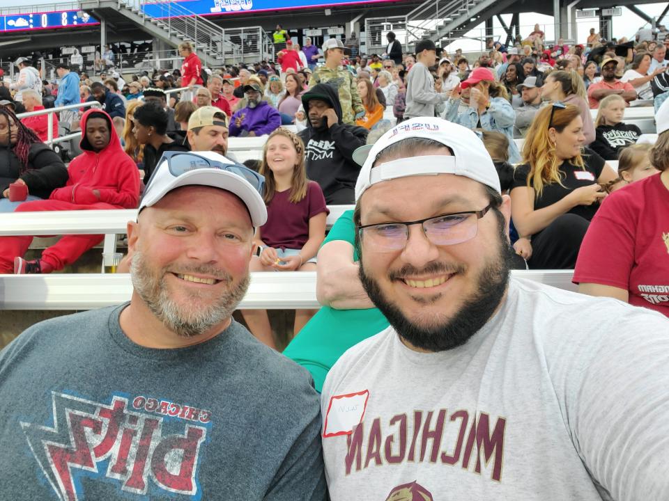 Zach Keilman, right, is shown at a USFL game in Birmingham, Alabama, earlier this season, with his father, Pete Keilman. The younger Keilman is planning to attend the inaugural USFL playoffs Saturday at Tom Benson Hall of Fame Stadium in Canton.