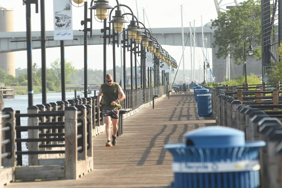 The northern end of the Wilmington riverwalk Monday June 13, 2022 stops just before the Isabel Holmes Bridge by the Sawmill Point Apartments.  The Wilmington City Council approved $50,000 in funding for a study that would look at extending Wilmington's riverwalk along the tidal marsh and possibly crossing under the bridges to the 4th street area. KEN BLEVINS/STARNEWS