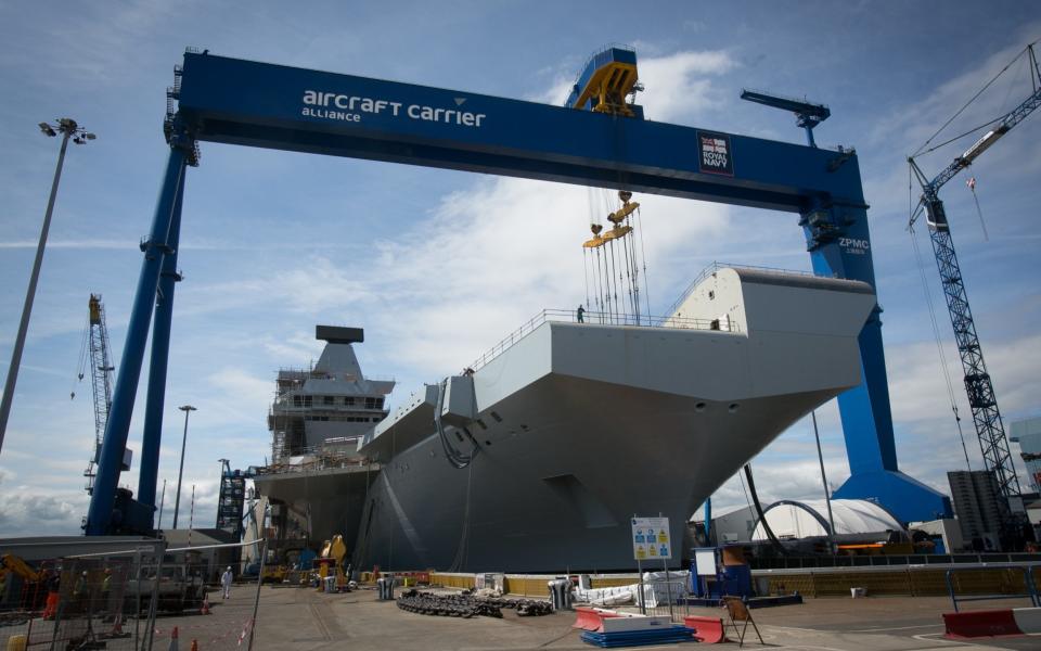 HMS Queen Elizabeth under construction at the dry dock in Rosyth, Scotland - Credit: Getty