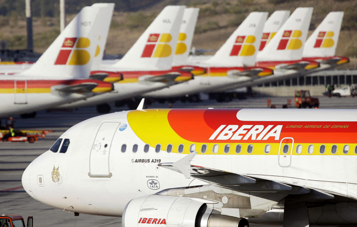 File - In this Nov. 12, 2009 file photo, Iberia planes are seen parked-up at Barajas airport in Madrid. Qatar Airways announced Friday, Jan. 30, 2015, that it has bought nearly 10 percent of the parent company of British Airways and Spain's Iberia, deepening wealthy Qatar's business ties to Europe and intensifying competition with the airline's fast-growing Gulf rivals. (AP Photo/Victor R. Caivano, File)