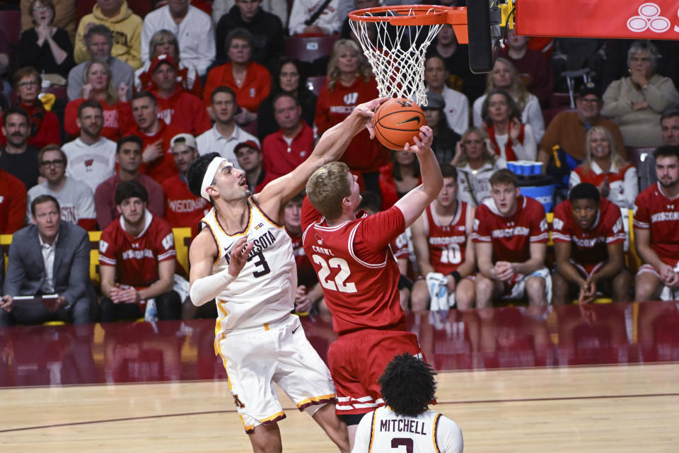 Minnesota forward Dawson Garcia (3) blocks a shot by Wisconsin forward Steven Crowl (22) during the second half of an NCAA college basketball game Tuesday, Jan. 23, 2024, in Minneapolis. (AP Photo/Craig Lassig)