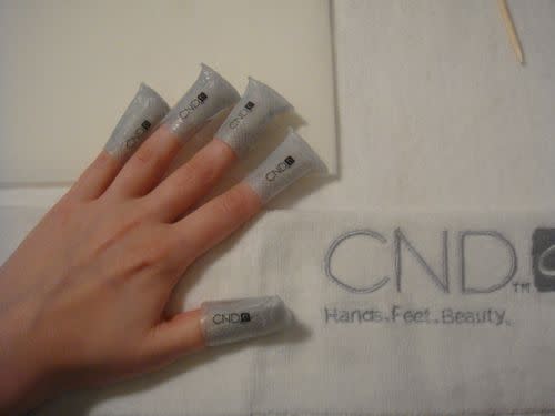 Time for removal! CND developed these Shellac remover wraps that are coated with acetone and wrap around the tips of your fingers like a sticker. They minimize nail contact with chemicals (yay!) and allow you to flip through a magazine or make a phone cal