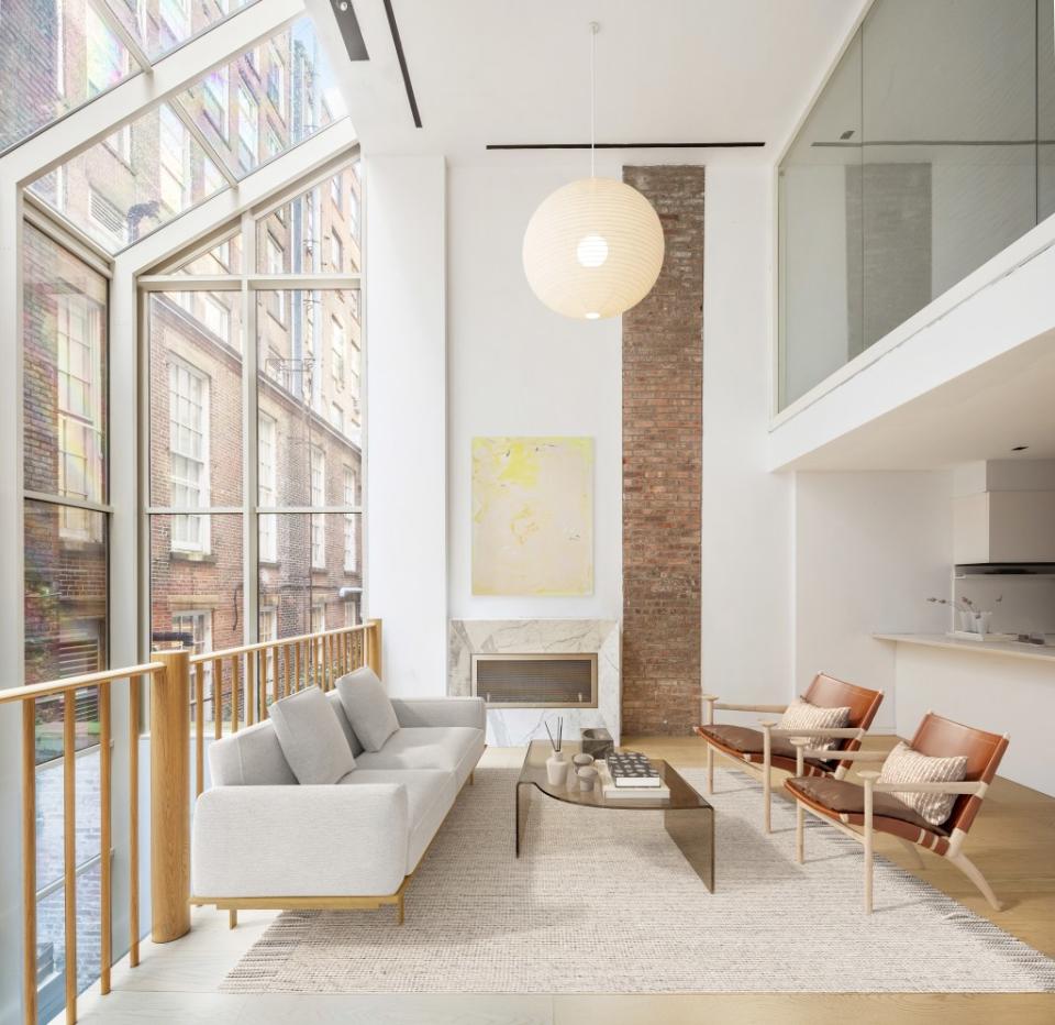 The great room comes with lofty ceiling heights in this Tribeca maisonette triplex. Shannon Dupre of DDreps