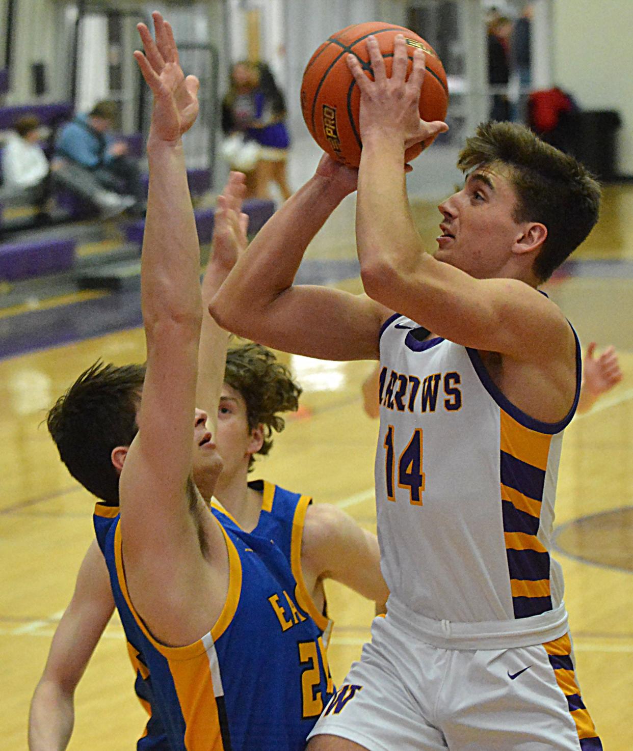 Watertown's Will Engstrom scores and is fouled by Aberdeen Central's Jacob Weishaar during their high school boys basketball game on Tuesday, Feb. 13, 2024 in the Watertown Civic Arena. Engstrom converted the conventional three-point play in Watertown's 74-71 win.