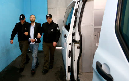 Jack Shepherd, who went on the run last year after killing a woman in a speedboat crash on the River Thames, is escorted during his extradition in Tbilisi, Georgia April 10, 2019. The Ministry of Internal Affairs of Georgia/Handout via REUTERS