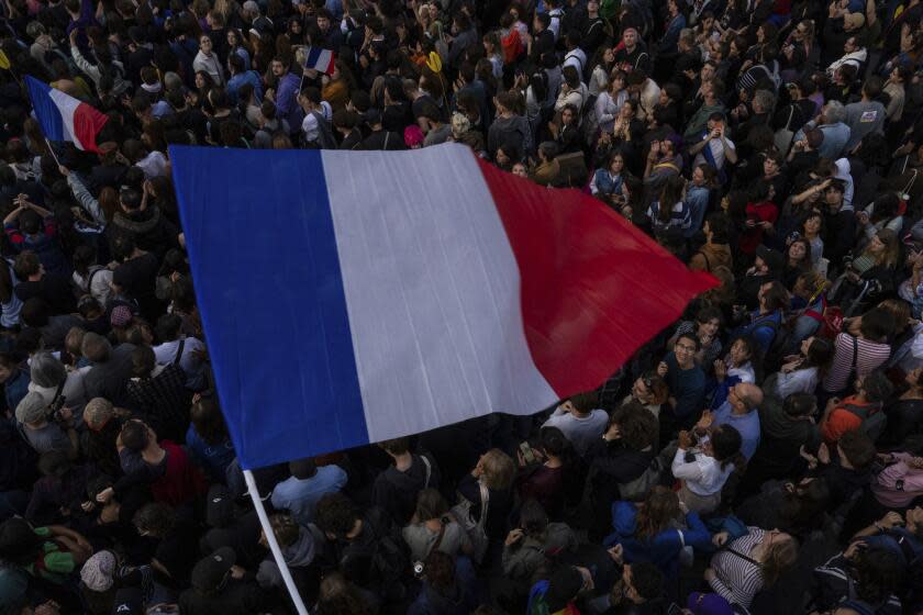 People gather at Republique plaza in a protest against the far-right, Wednesday, July 3, 2024, in Paris. French opposition parties and associations are trying to block a landslide victory for Marine Le Pen's far-right National Rally in next Sunday's second round of legislative elections. (AP Photo/Louise Delmotte)