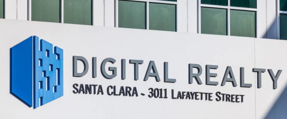 The logo for REIT Digital Realty on the side of a Silicon Valley data center building