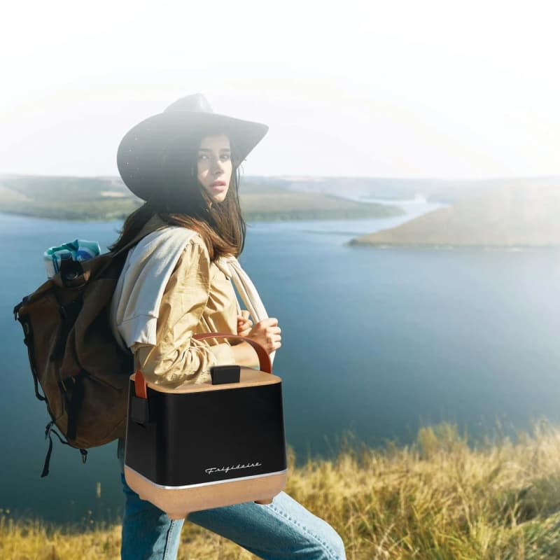 woman carrying a Frigidaire-portable-6-can cooler