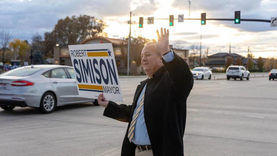 Meridian incumbent Mayor Robert Simison waves to motorists at the corner of Cherry Lane and Meridian Road on Election Day, Nov. 7, 2023. Sarah A Miller