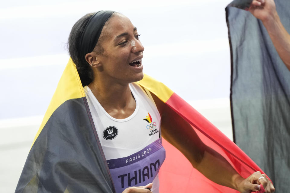 Nafissatou Thiam, of Belgium, celebrates after winning the women's heptathlon at the 2024 Summer Olympics, Friday, Aug. 9, 2024, in Saint-Denis, France. (AP Photo/Martin Meissner)