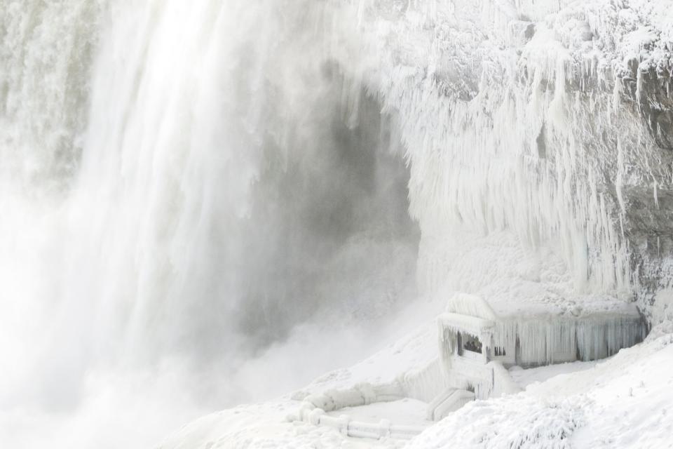 Ice coats the rocks and observation deck at the base of the Horseshoe falls in Niagara Falls, Ontario on January 3, 2018.
The cold snap which has gripped much of Canada and the United States has nearly frozen over the American side of the falls. / AFP PHOTO / Geoff RobinsGEOFF ROBINS/AFP/Getty Images ORIG FILE ID: AFP_VL1YQ