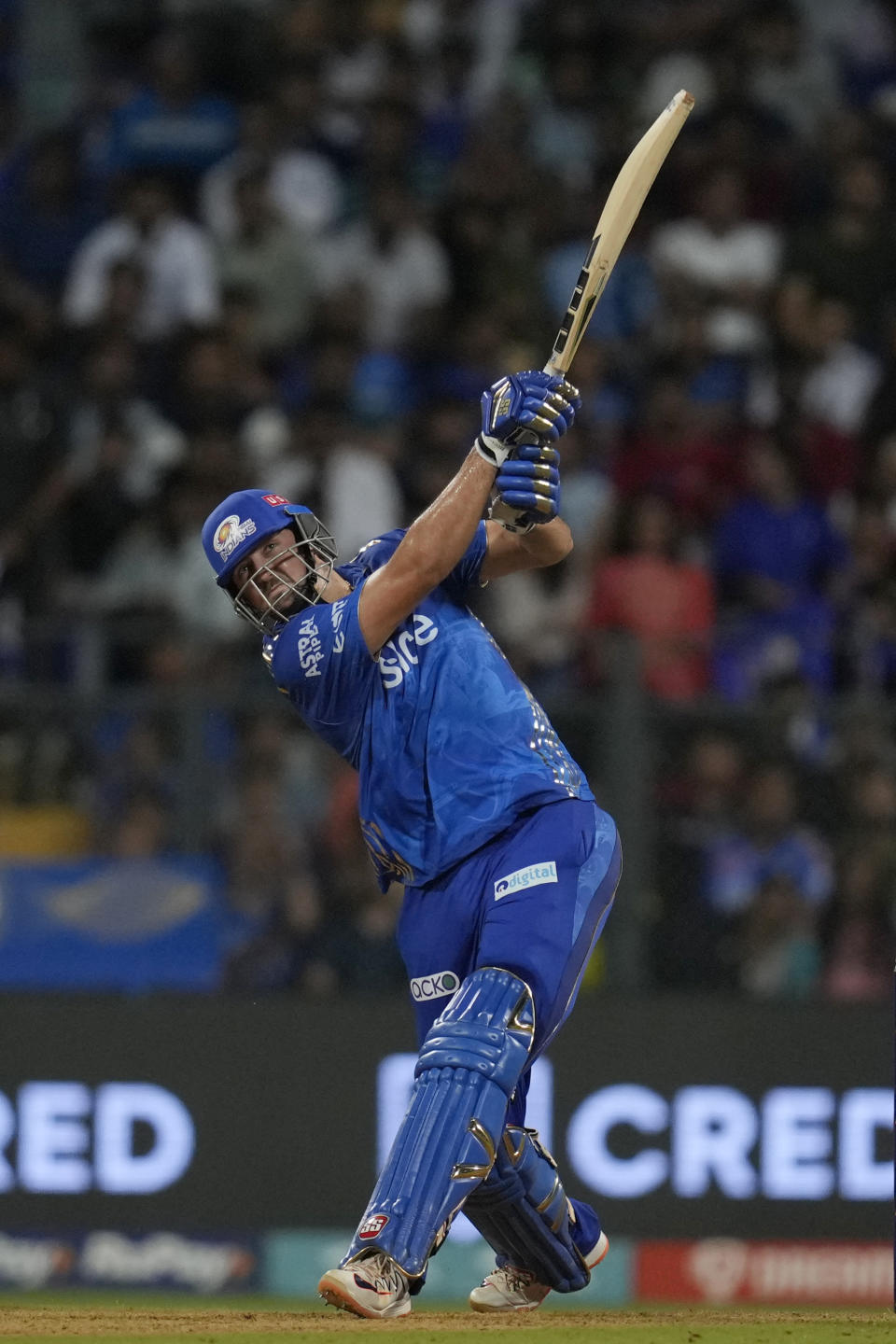 Mumbai Indian's Tim David plays a shot during the Indian Premier League cricket match between Mumbai Indians and Rajasthan Royals in Mumbai, India, Sunday, April 30, 2023. (AP Photo/Rajanish Kakade)