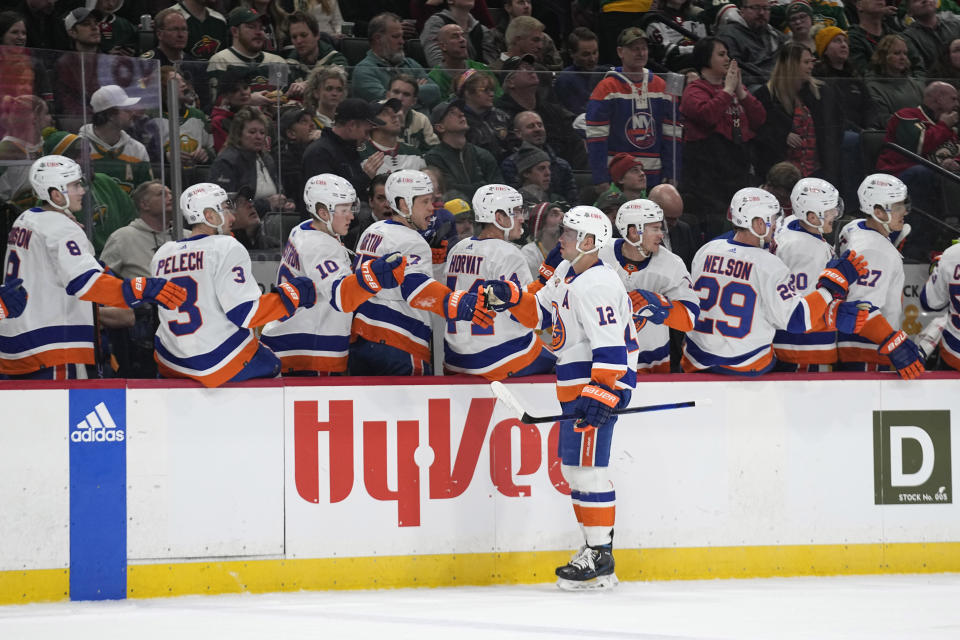 New York Islanders right wing Josh Bailey (12) celebrates with teammates after scoring against the Minnesota Wild during the first period of an NHL hockey game Tuesday, Feb. 28, 2023, in St. Paul, Minn. (AP Photo/Abbie Parr)