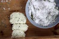 In this photo taken Wednesday Dec. 11, 2019, Cyprus' halloumi cheeses are seen after salting at a farm in Kampia village near Nicosia, Cyprus. Cyprus' halloumi cheese, with a tradition dating back some five centuries, is the island nation's leading export. It's goat and sheep milk content makes it a hit with health-conscious cheese lovers in Europe and beyond. It's added appeal is that unlike other cheeses, it doesn't melt when heated up. (AP Photo/Petros Karadjias)