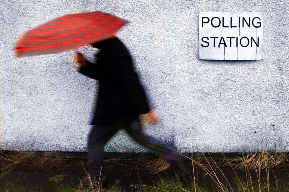 Britons headed to the polls in the rain this week (PA Archive)