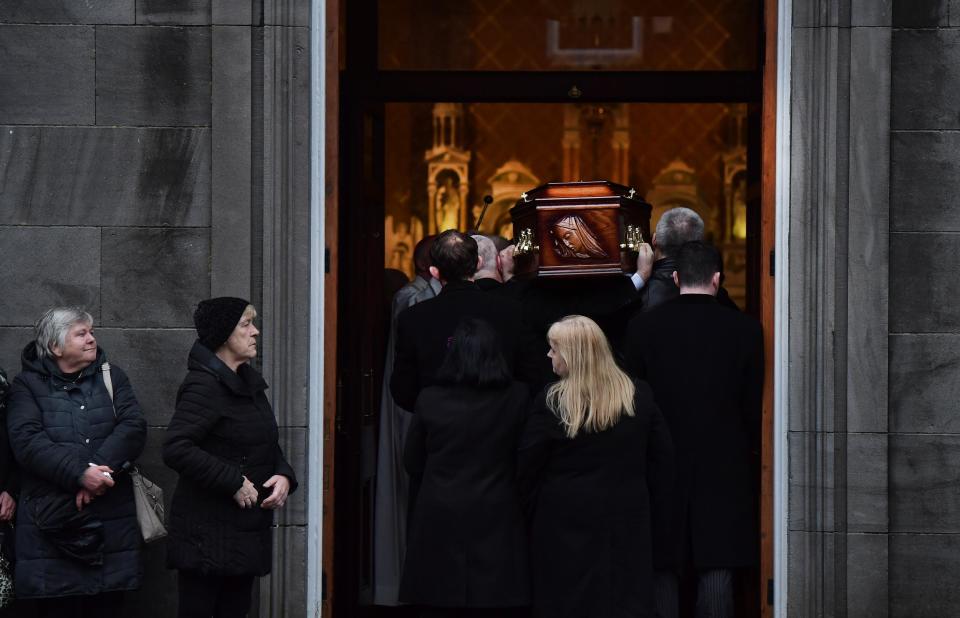 Eileen O'Riordan follows her daughter’s remains as she is carried into St Joseph’s Church: Charles McQuillan/Getty