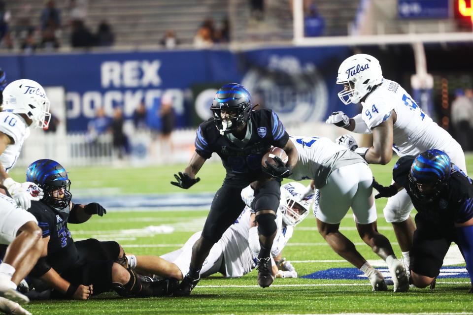 Memphis Tigers Asa Martin (28) rushes by TulsaÕs Anthony Goodlow (94) and looks to make a move against Sean OÕKeefe (10) during a game on Nov. 10, 2022 at Simmons Bank Liberty Stadium in Memphis.