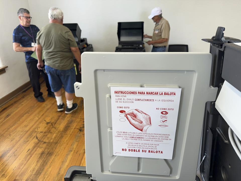 A voter submits his ballot in Bernalillo, N.M., on Tuesday, June 4, 2024. New Mexico voters are picking their partisan favorites in Tuesday's primary to reshape a Democratic-led Legislature, with all 112 seats up for election in November. (AP Photo/Susan Montoya Bryan)