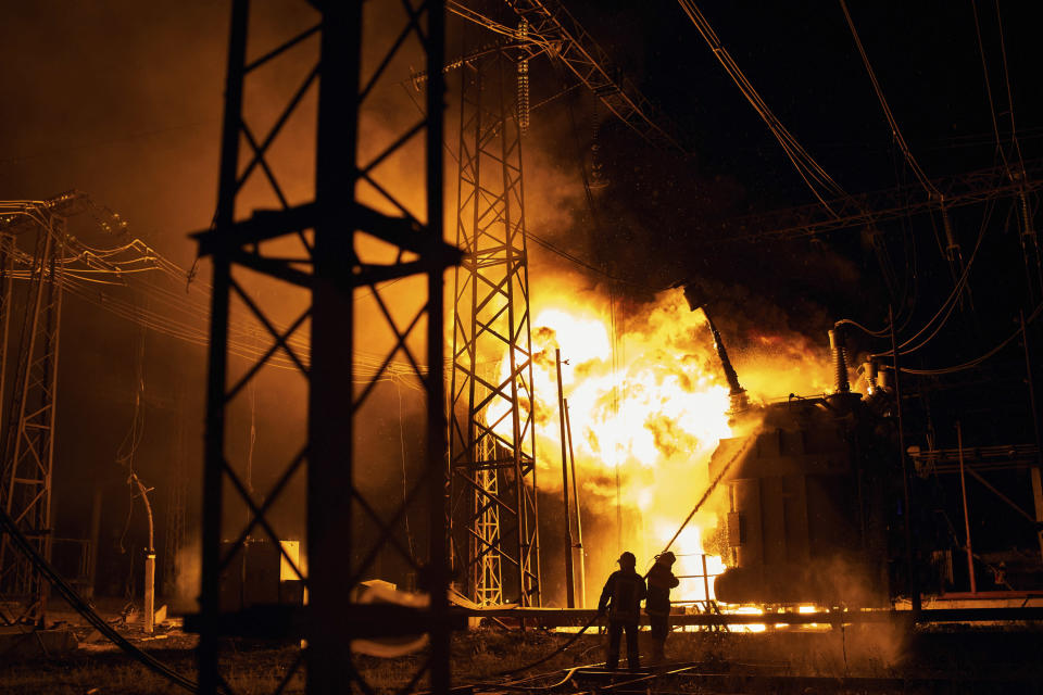 Ukrainian State Emergency Service firefighters put out the fire after a Russian rocket attack hit an electric power station in Kharkiv, Ukraine, Sunday, Sept. 11, 2022. The Kharkiv and Donetsk regions have been completely de-energised in the rocket attack.(AP Photo/Kostiantyn Liberov)