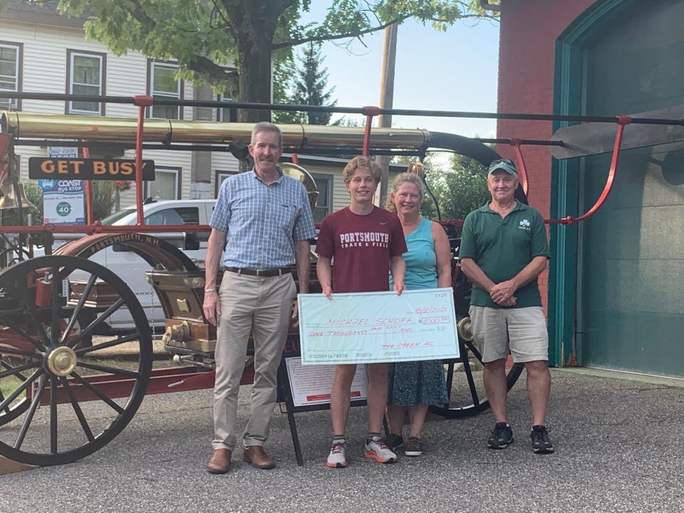 Alec McEachern, left to right, Michael Schoff, his mother Tara Schoff and Mike Timmons at the presentation of the 2022 Creek Athletic Club's Scholarship to Michael Schoff during the National Night Out Celebration.