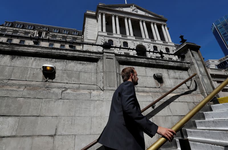 A man emerges from Bank underground station opposite the Bank of England, in London