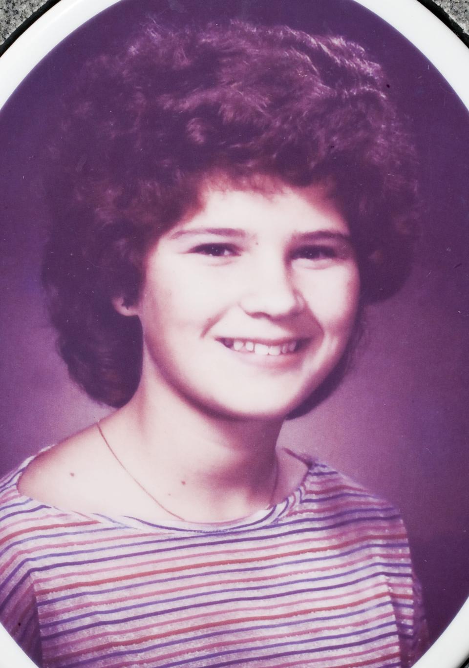 The headstone photo of Kelly Cooper, a 16-year-old girl murdered in 1984.