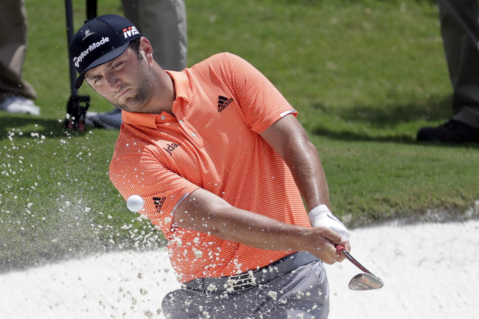 Jon Rahm, of Spain, hits from the sand on the fourth hole during the third round of the World Golf Championships-FedEx St. Jude Invitational Saturday, July 27, 2019, in Memphis, Tenn. (AP Photo/Mark Humphrey)