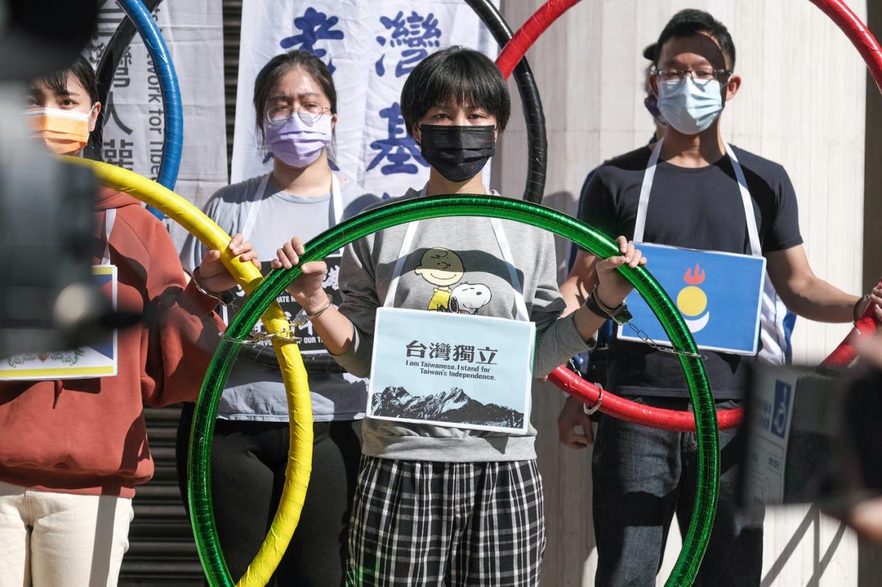 <span class="caption">Taiwanese independence activists call for a boycott of the Beijing Games.</span> <span class="attribution"><a class="link " href="https://www.gettyimages.com/detail/news-photo/activists-holding-signs-and-olympic-rings-calling-for-the-news-photo/1237989217?adppopup=true" rel="nofollow noopener" target="_blank" data-ylk="slk:Walid Berrazeg/Anadolu Agency via Getty Images;elm:context_link;itc:0;sec:content-canvas">Walid Berrazeg/Anadolu Agency via Getty Images</a></span>