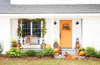 <p>Use a basket as a canvas and weave fall leaves and plants through it for a homemade door decoration this Thanksgiving. </p>