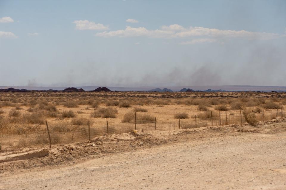 A weekslong fire continues smoldering over the 80-acre compost pit at the Synagro composting facility near Hinkley, Calif., on June 28, 2022.