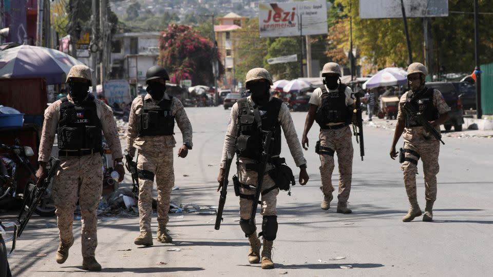 Police patrol a street after authorities extended the state of emergency amid gang violence that has forced thousands to flee their homes in Port-au-Prince, Haiti, March 8, 2024. - Ralph Tedy Ero/Reuters/File