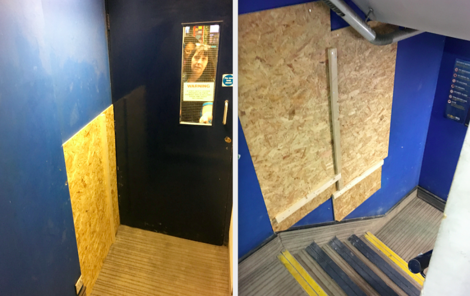 <em>Two gaping holes have been boarded up at a William Hill shop next to the Fleet Street jewellery shop (SWNS)</em>